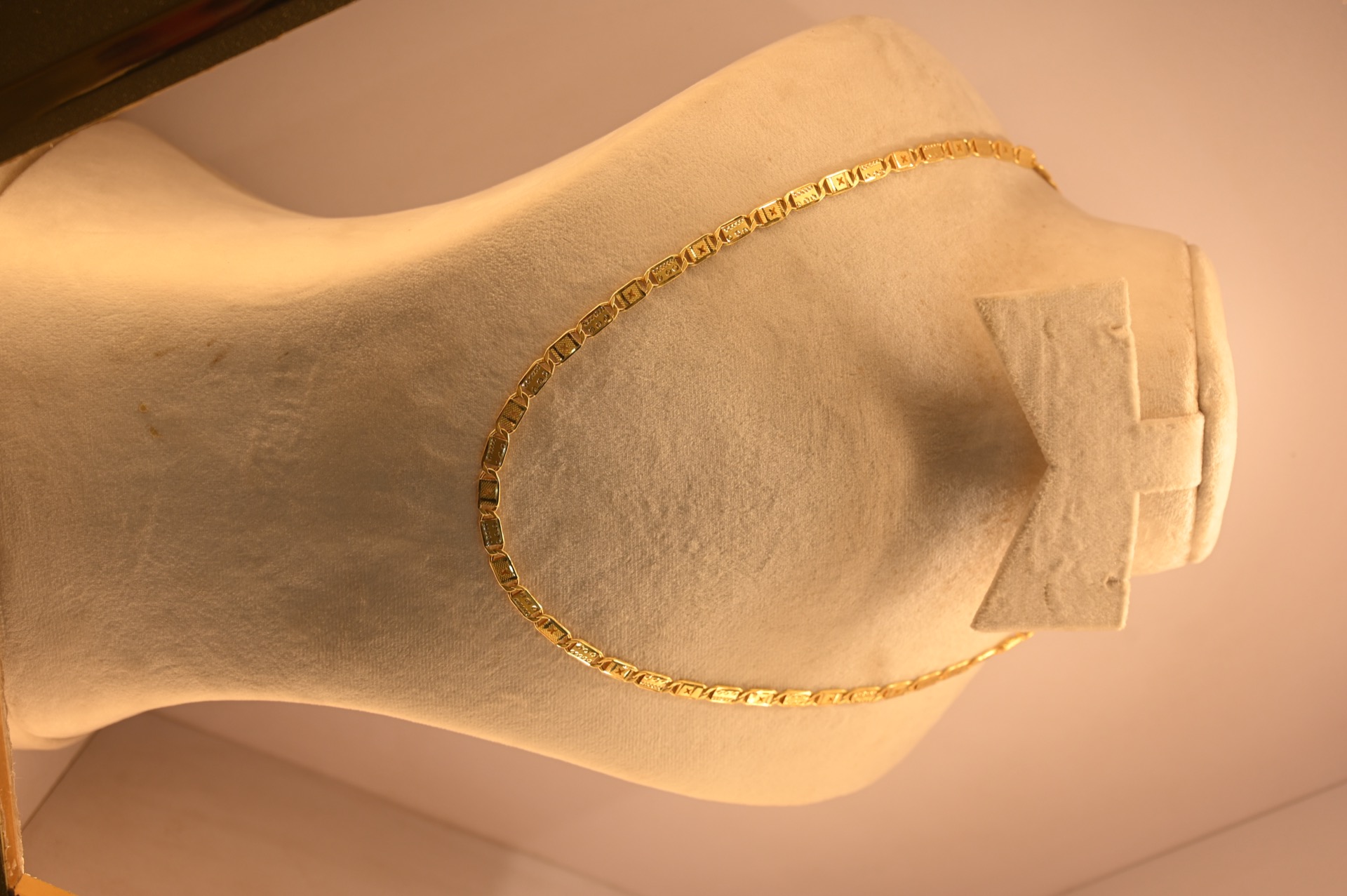 Gold chain with charm
