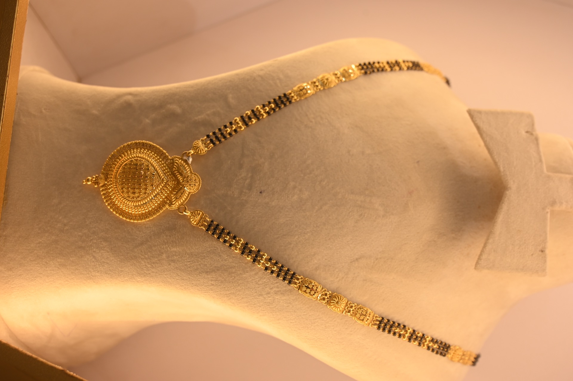 Gold mangalsutra with central pendant